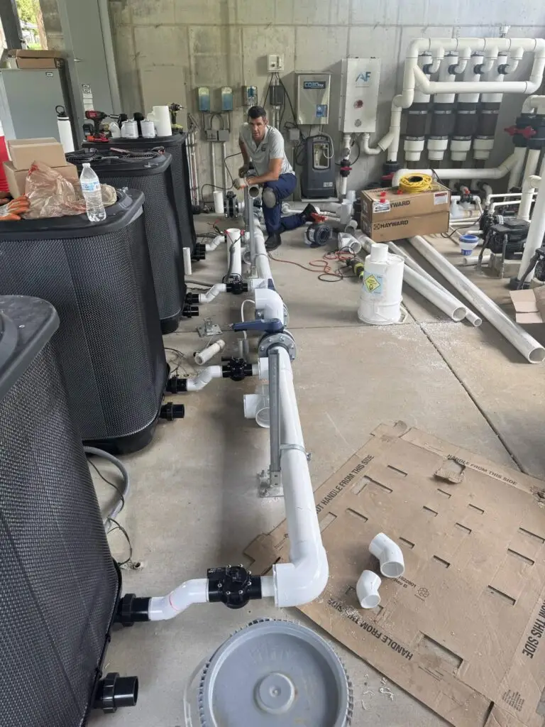 Passion Pool Care technician rebuilding pool pump, filter and PVC plumbing